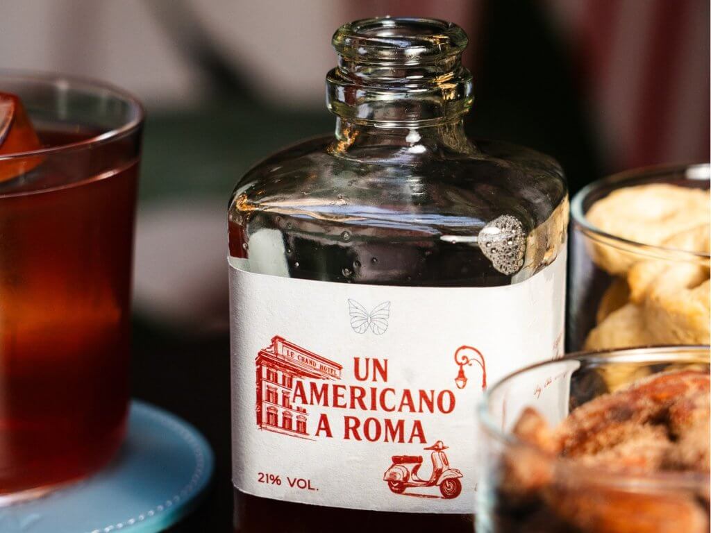 Etichetta «Un Americano a Roma» e bicchiere, Lumen Garden, Lion Brand